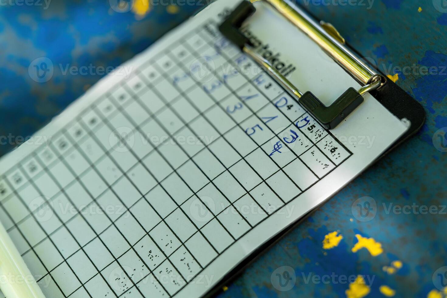 clipboard with a bunch of numbers on it photo