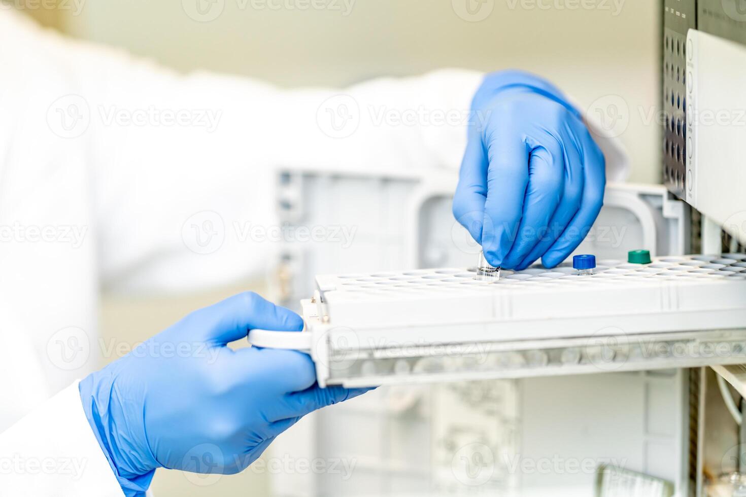 conducting chemical experiments in modern devices in a research laboratory photo