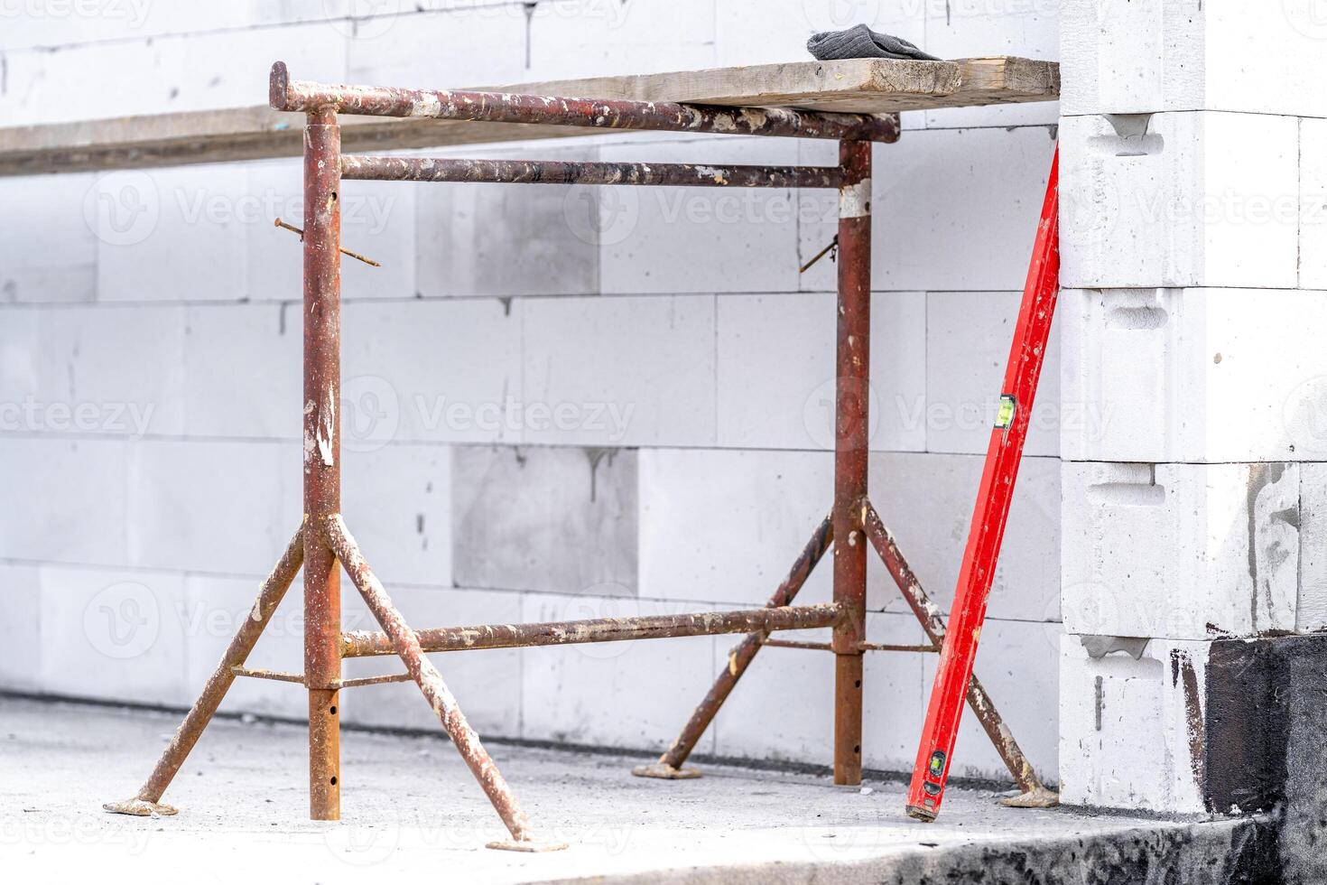 scaffolding on the construction of a house during the construction of a wall photo