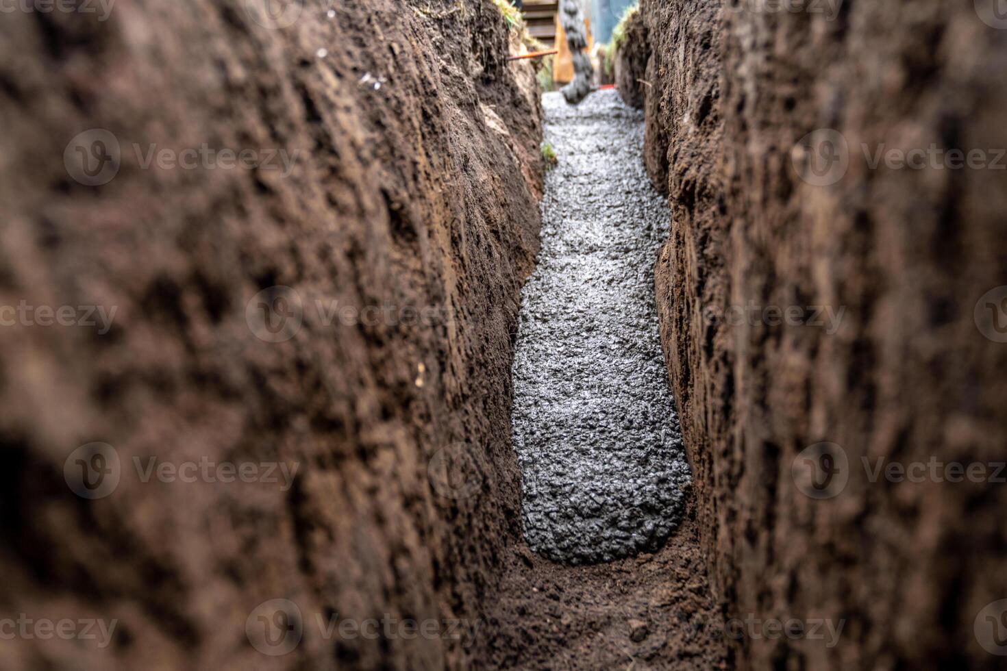 cementing the foundation in the ground when building a house photo