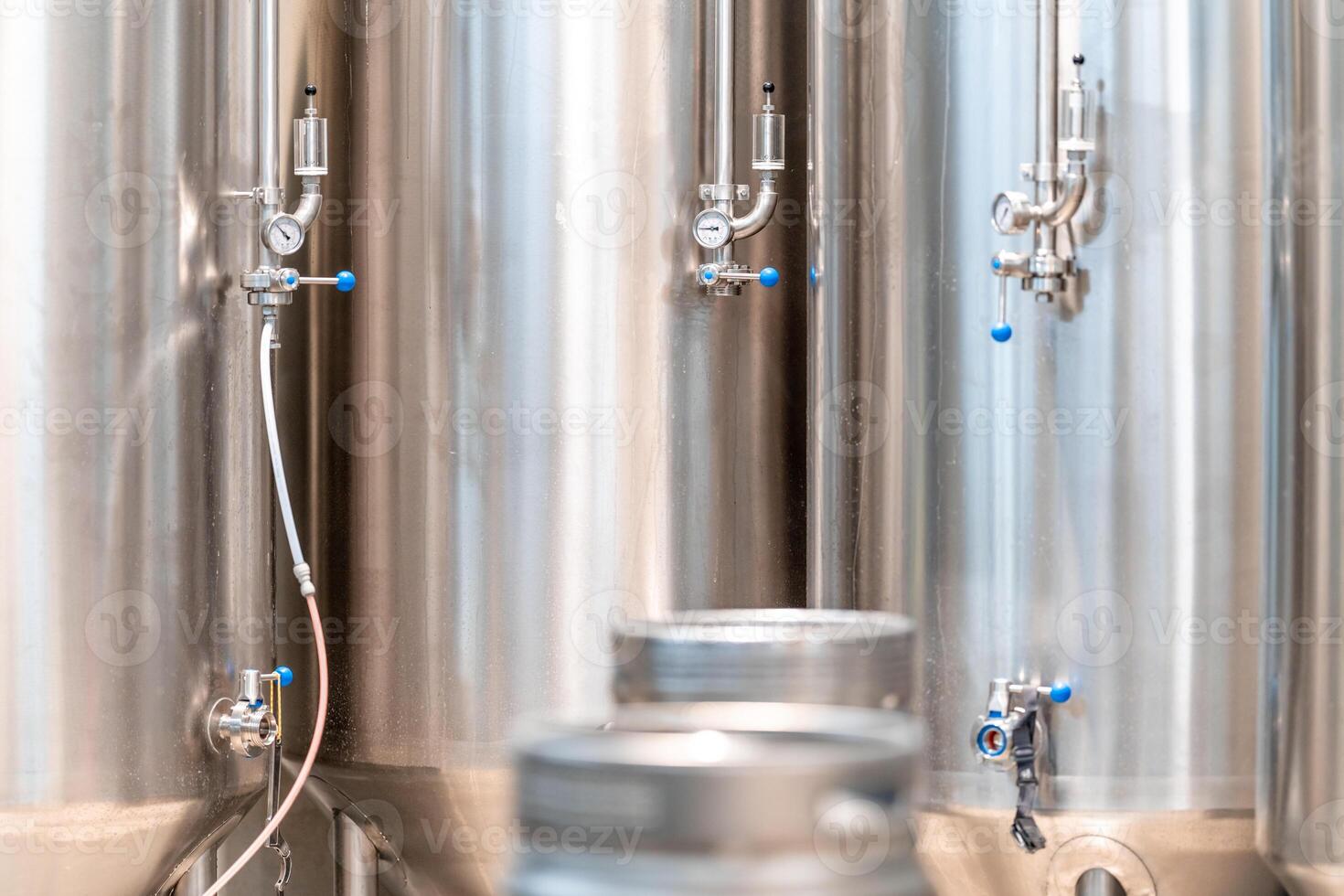 stainless steel tanks for brewing beer in a brewery photo