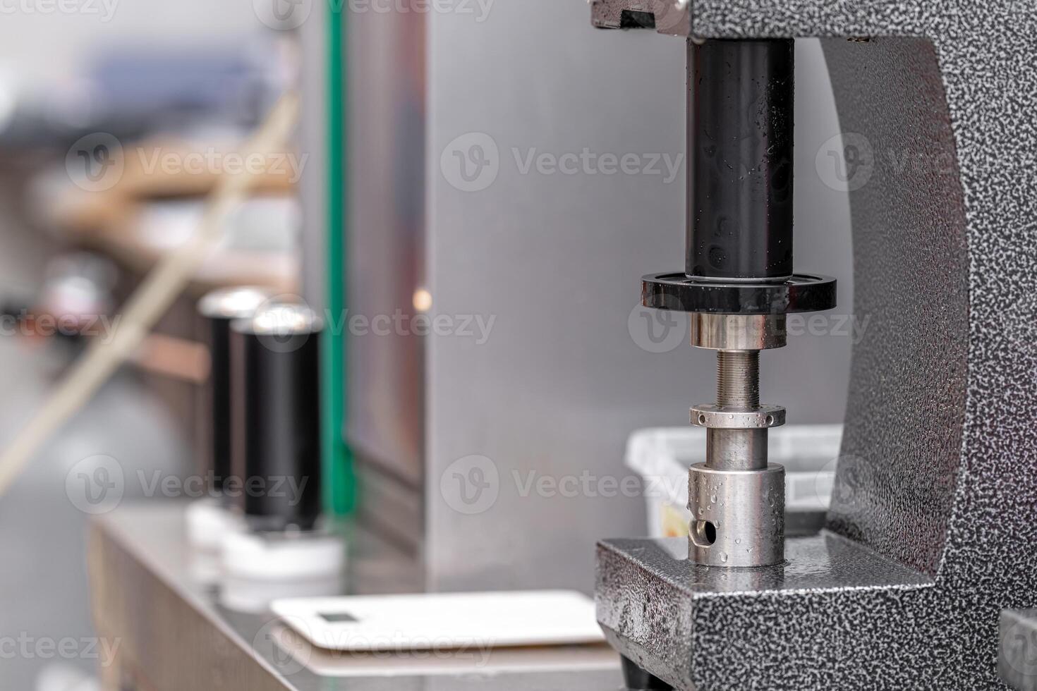 closed with the lid of beverage cans in an automatic capping machine in a brewery photo