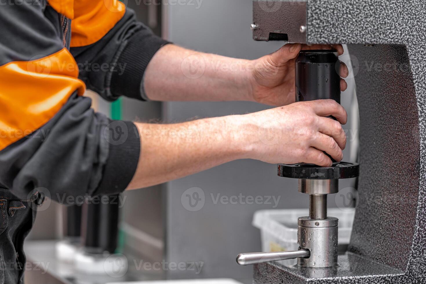 closed with the lid of beverage cans in an automatic capping machine in a brewery photo