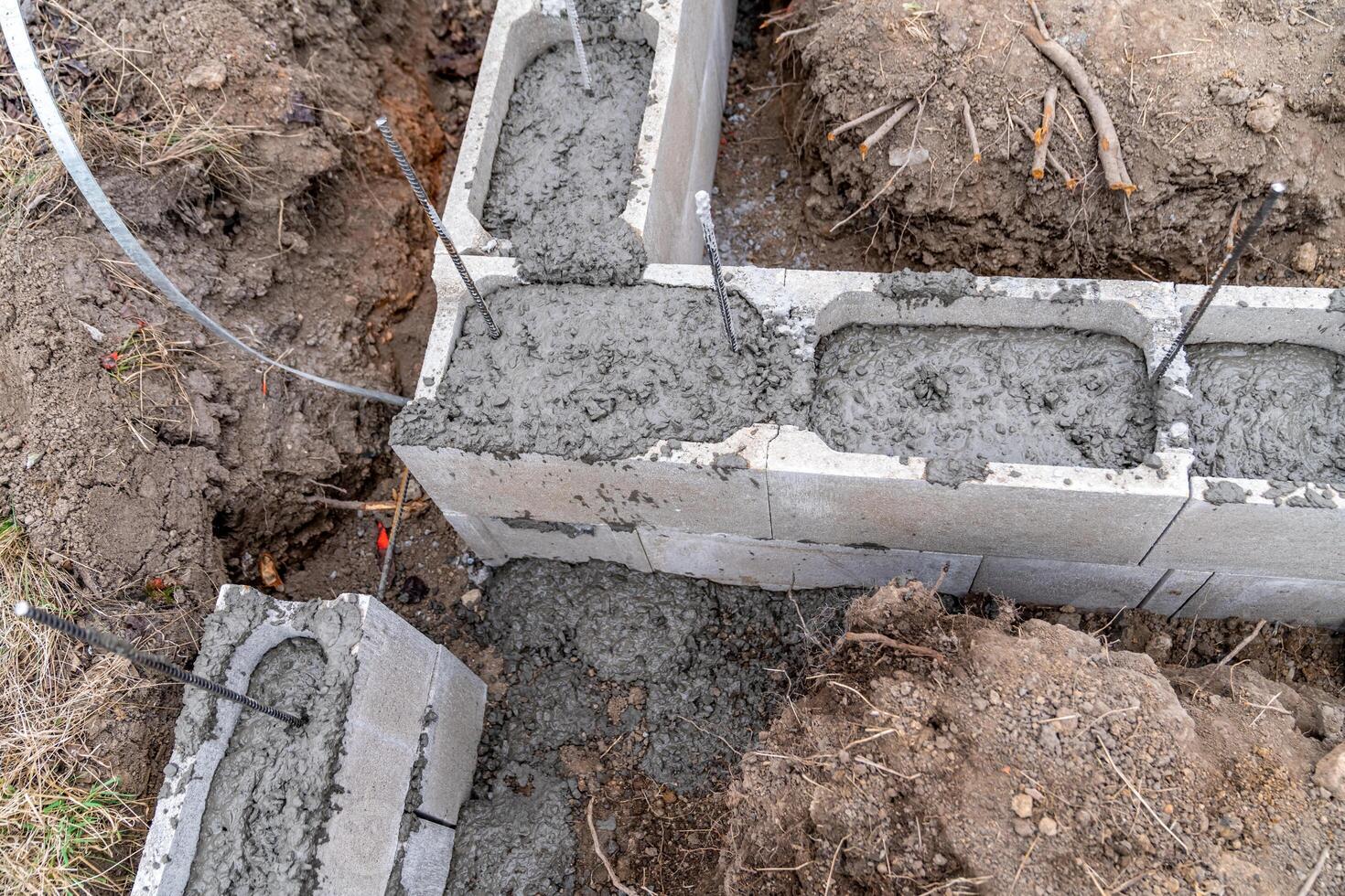concreting of the foundation of a new building at the construction site photo