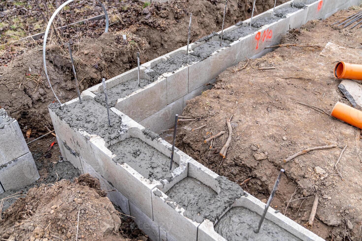 concreting of the foundation of a new building at the construction site photo