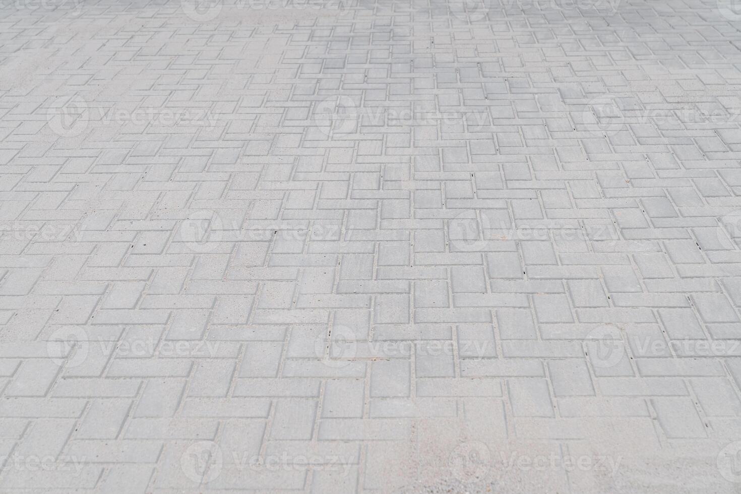 new sidewalk made of concrete interlocking paving blocks photo