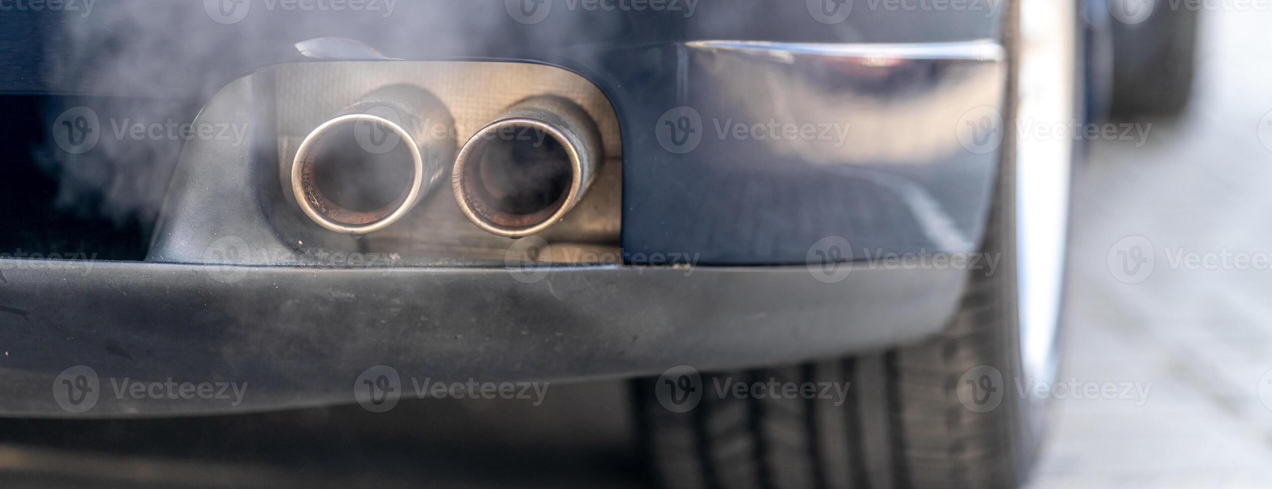 smoke from the exhaust of a car with a gasoline engine photo