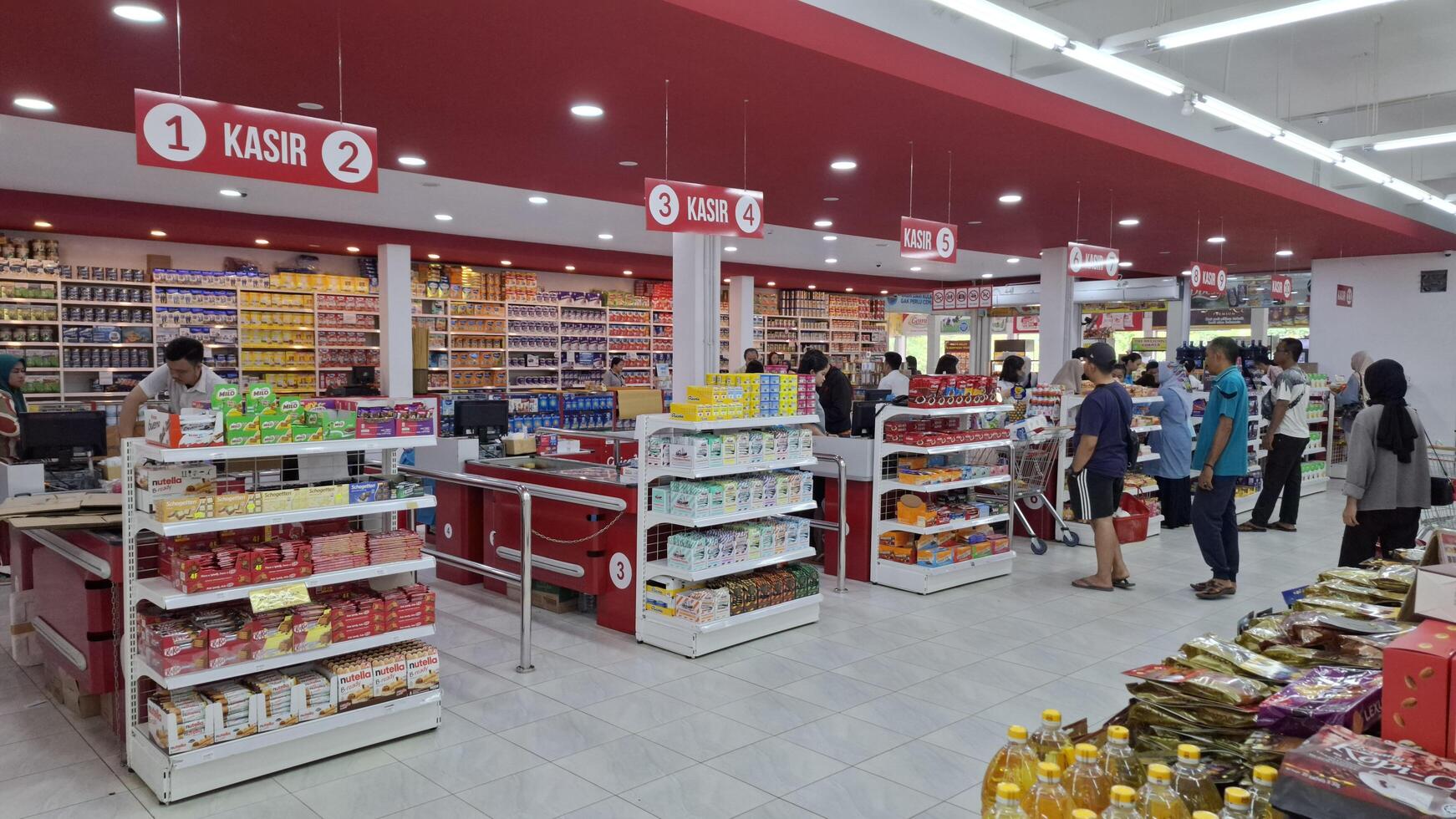 Inside a busy supermarket checkout area photo
