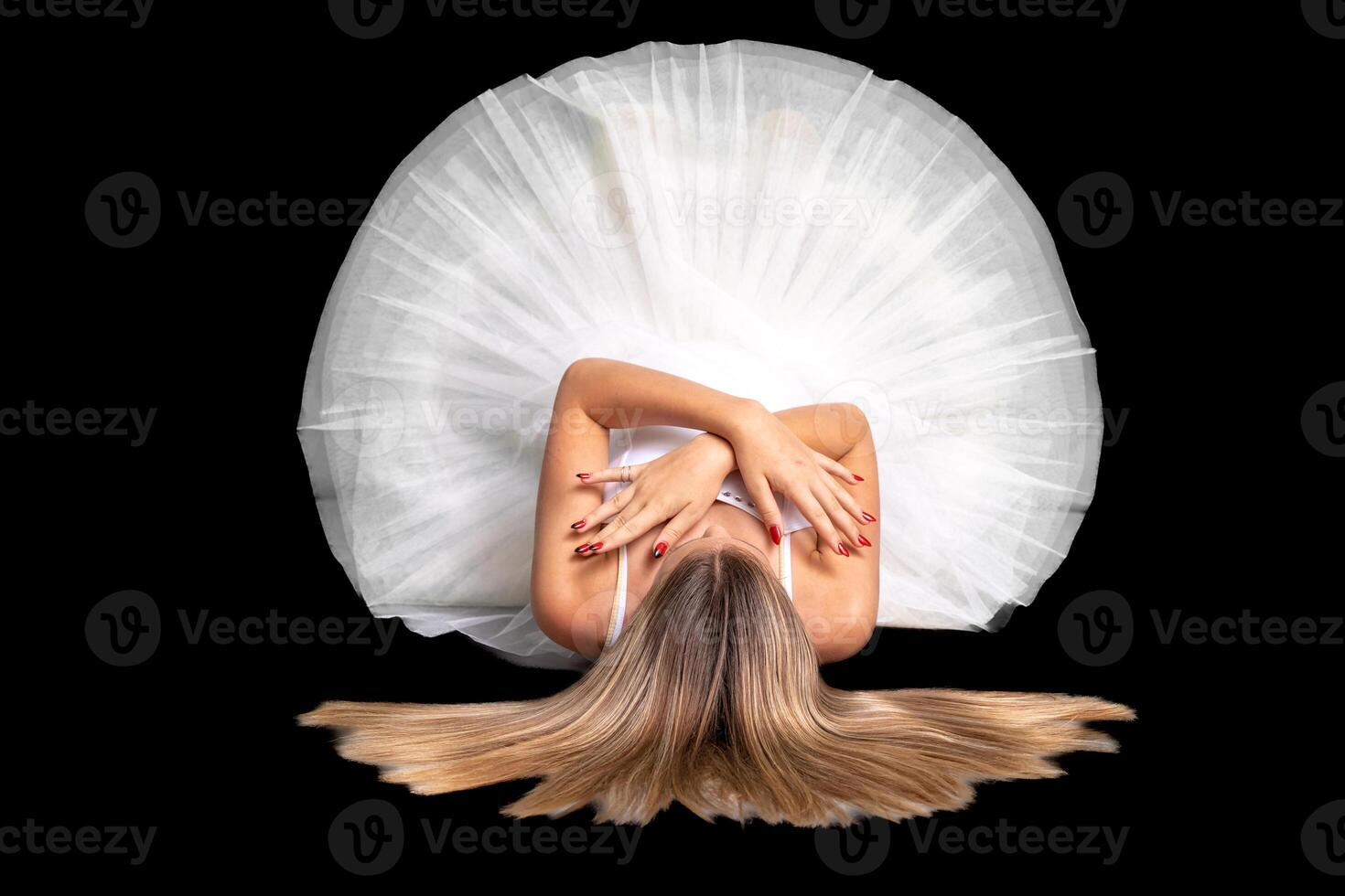 portrait of a ballerina in a pose, black background photo