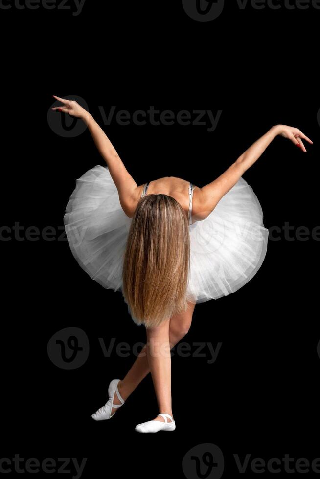portrait of a ballerina in a pose, black background photo
