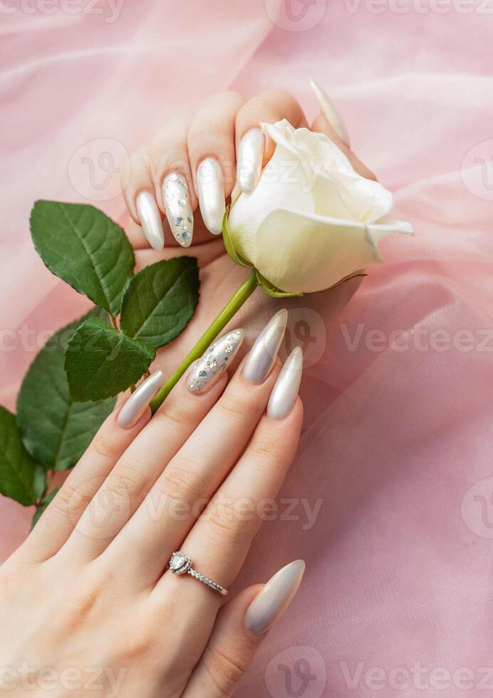 Female Hands with beautiful pearl manicure photo