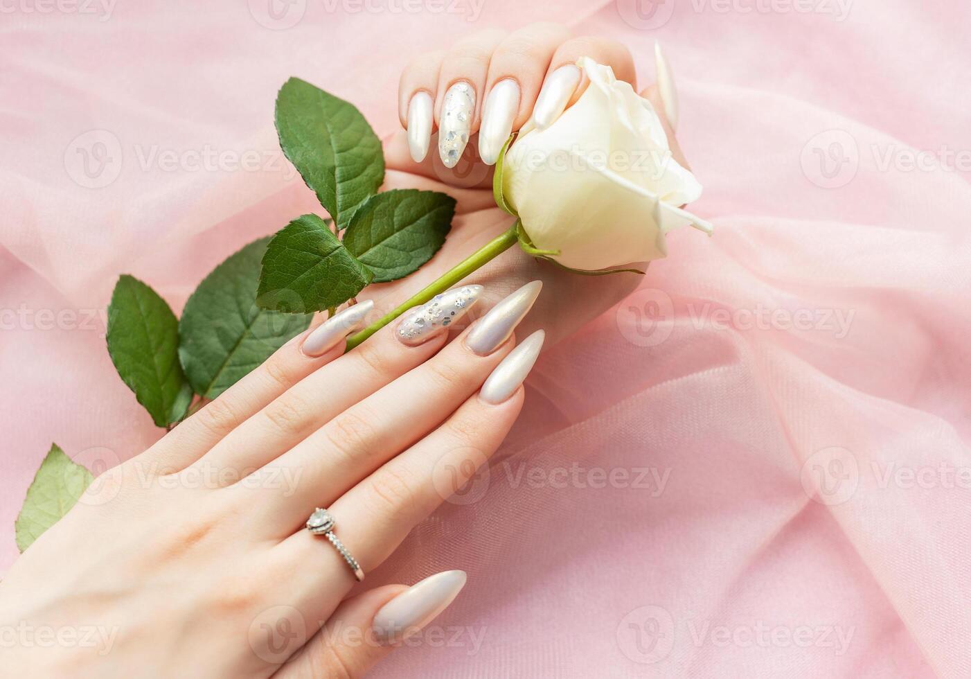 Female Hands with beautiful pearl manicure photo