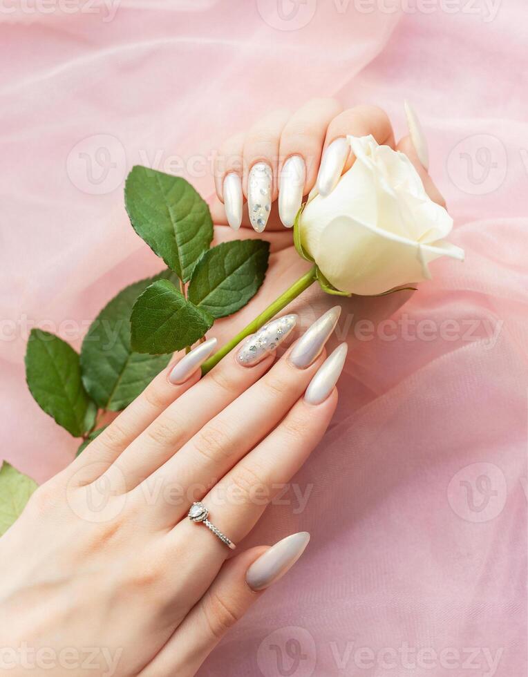 Female Hands with beautiful pearl manicure photo