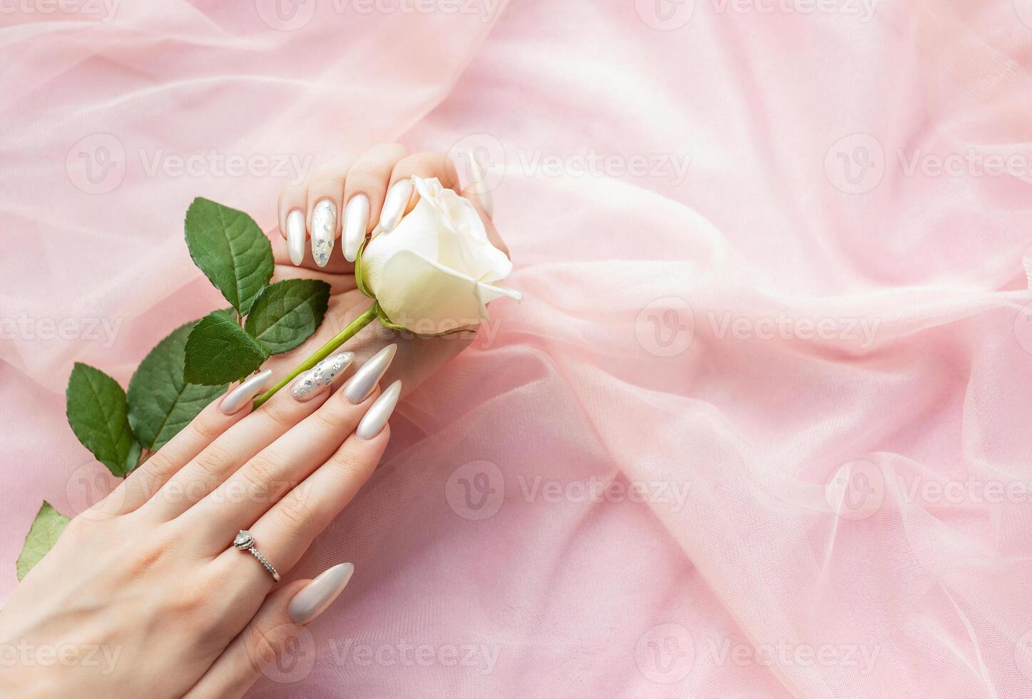 Female Hands with beautiful pearl manicure photo