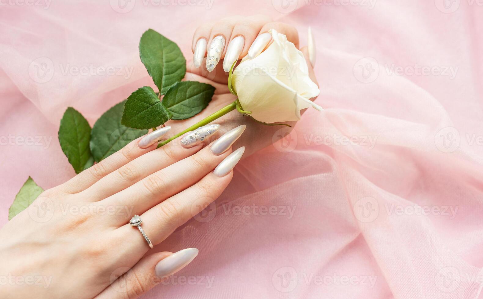 Female Hands with beautiful pearl manicure photo