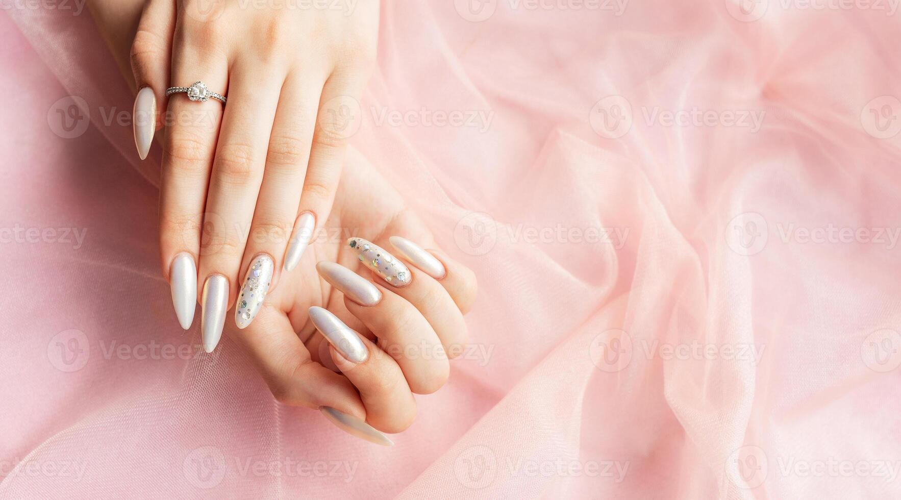 Female Hands with beautiful pearl manicure photo