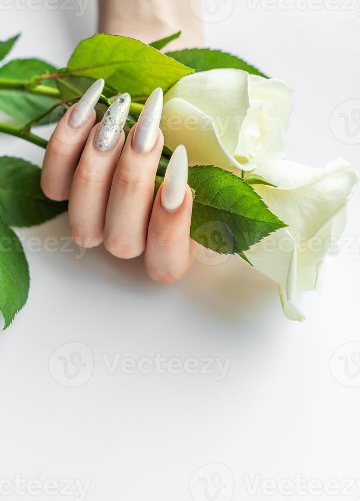 Female Hands with beautiful pearl manicure photo