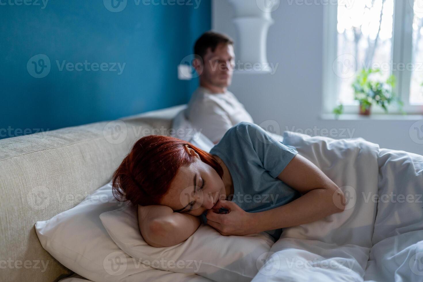 Offended unhappy woman after quarrel with boyfriend in bedroom. Difficult relations family conflict. photo