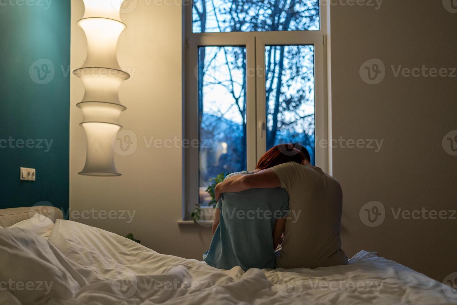 Loving man calms down upset wife after quarrel. Support in family. Depressed woman need mental help photo