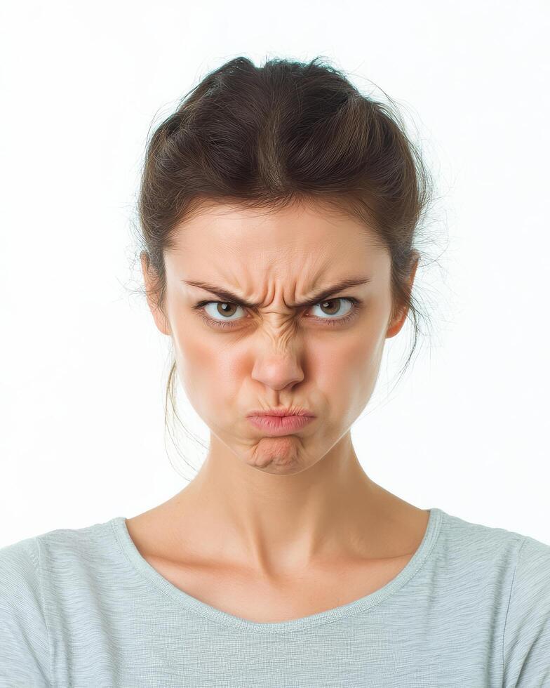 A woman with a serious expression conveys deep discontent and frustration photo