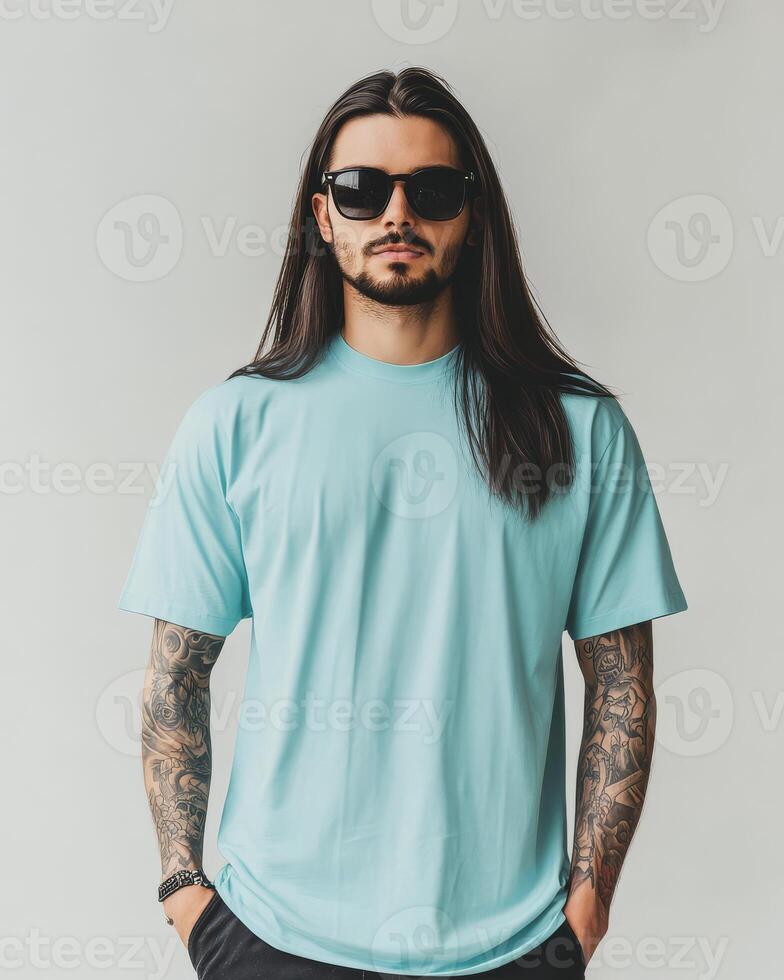 A stylish model displays a plain t-shirt against a simple backdrop photo