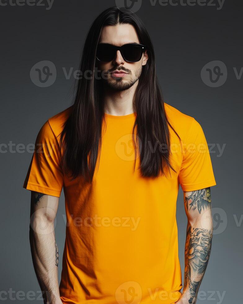 A male model presents a vibrant t-shirt with confidence and style photo