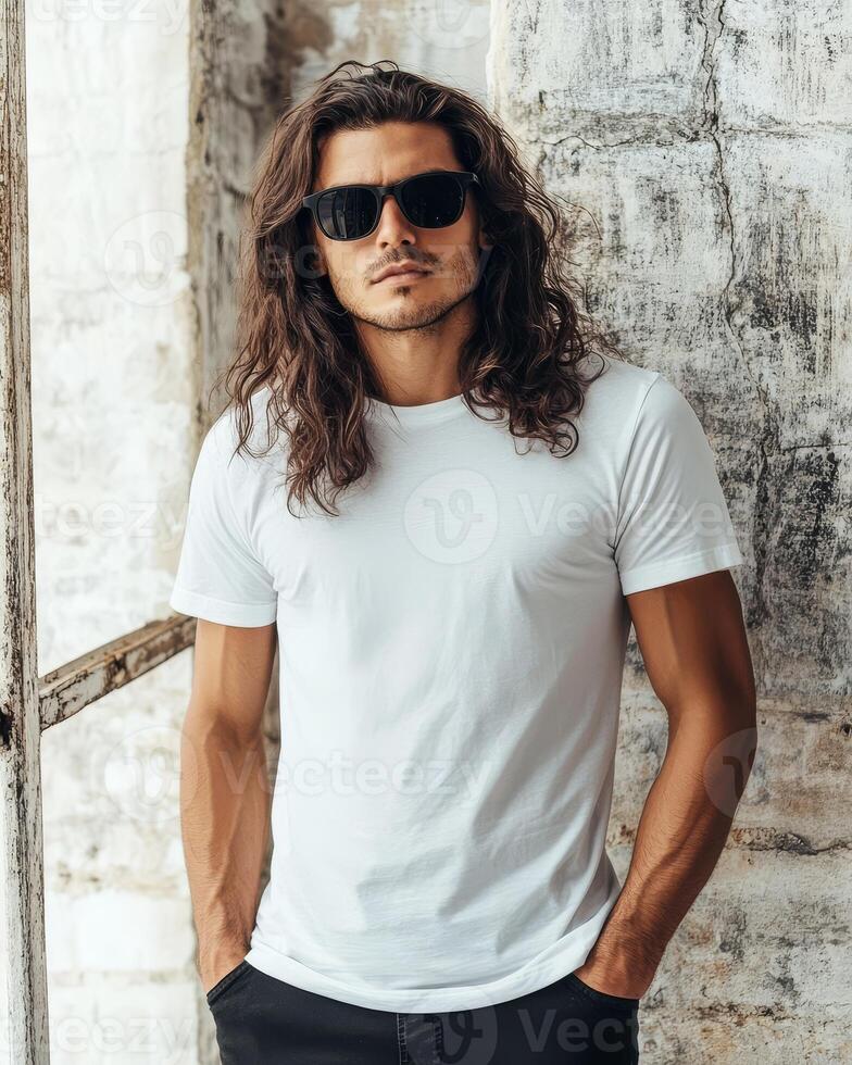 Handsome model showcases a blank t-shirt with a relaxed, cool demeanor photo