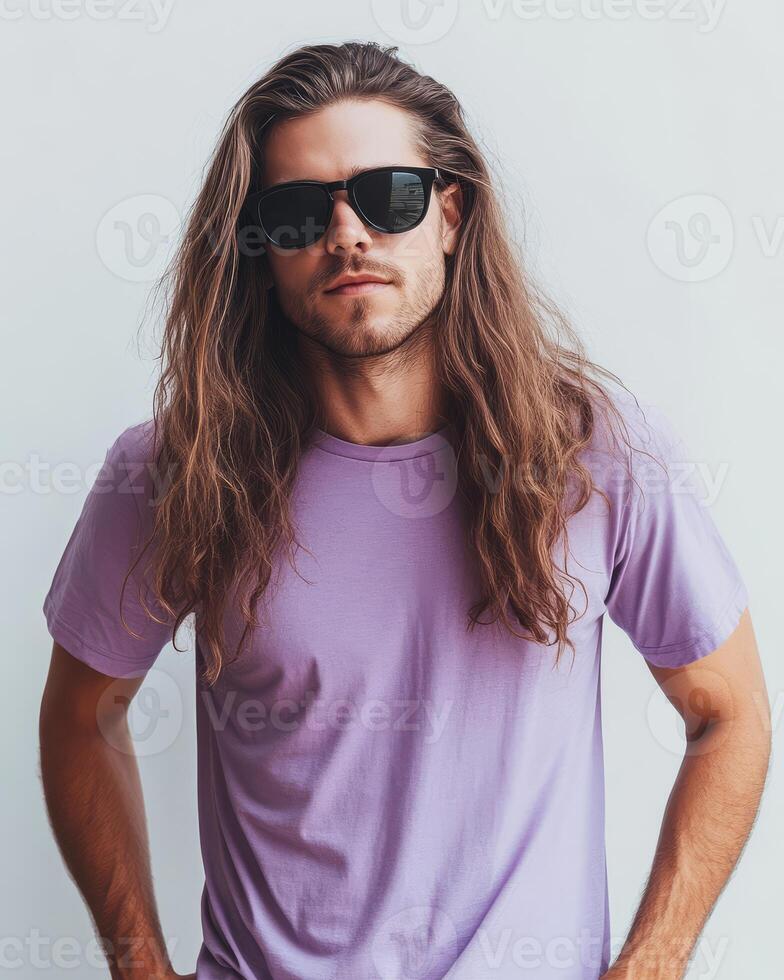 A stylish model poses confidently in a plain t-shirt with long hair photo