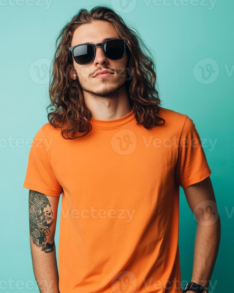 A handsome model confidently poses in a vibrant t-shirt photo