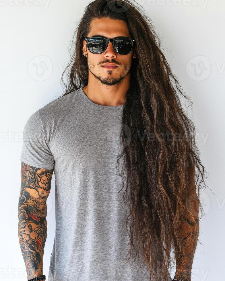 Model exudes confidence while wearing a plain t-shirt and sunglasses photo