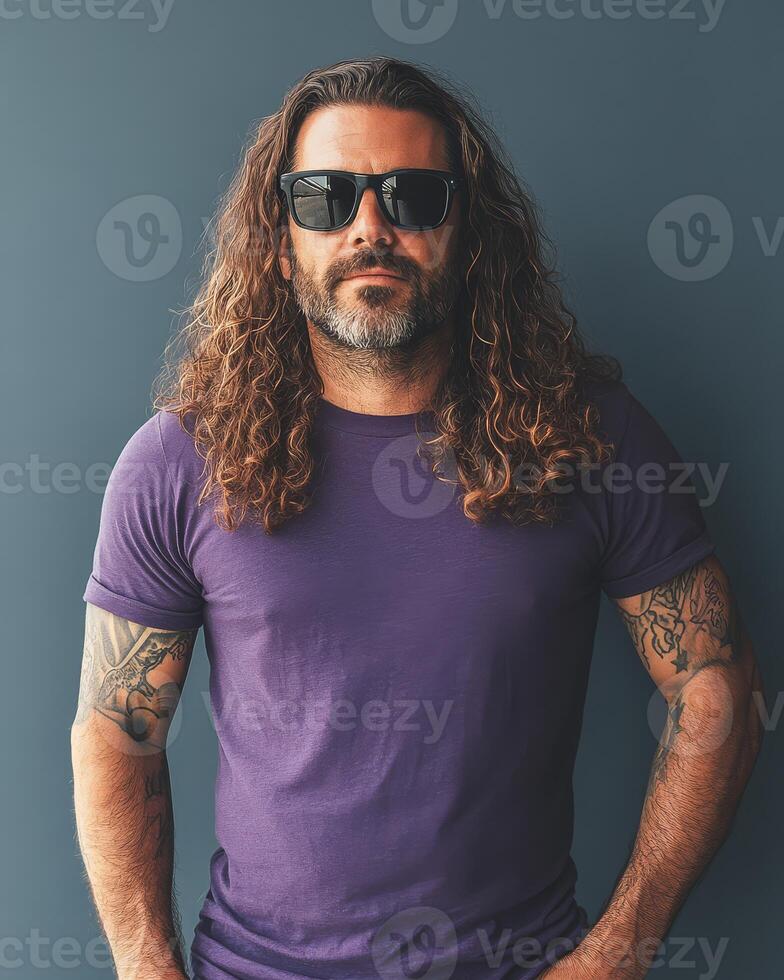 Model poses confidently in a blank t-shirt with sunglasses and striking long hair photo