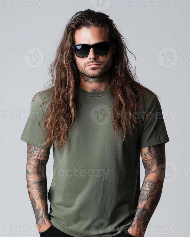 Model confidently displays casual fashion with long hair and tattoos photo