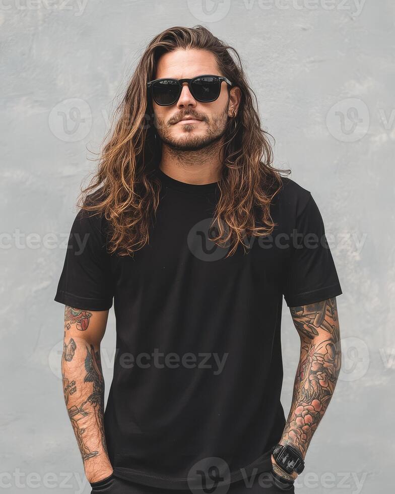 A stylish model stands confidently in a blank t-shirt under bright sunlight photo