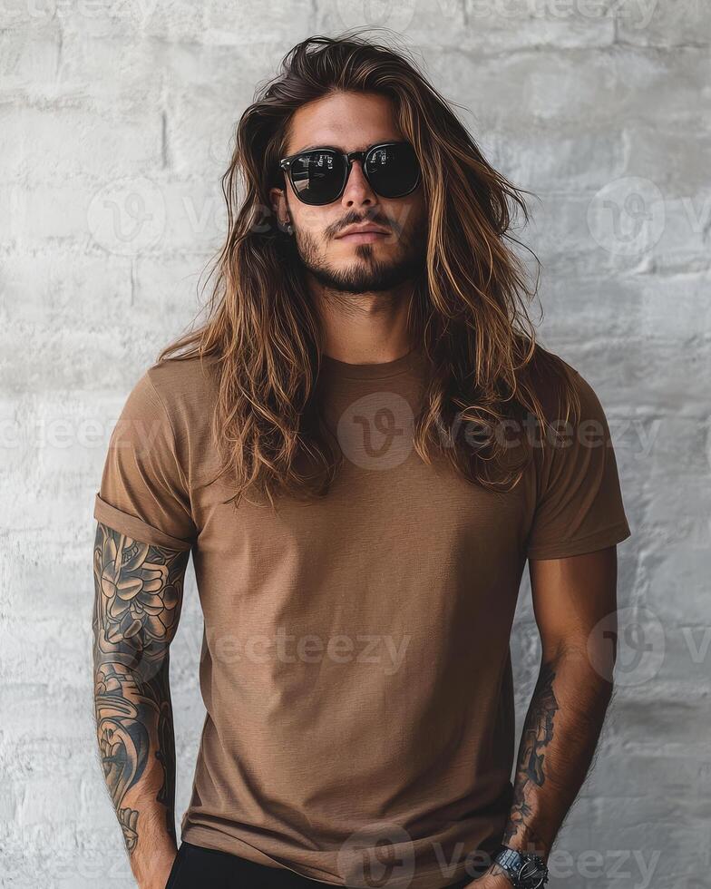 A handsome model poses confidently in a blank t-shirt, exuding style photo