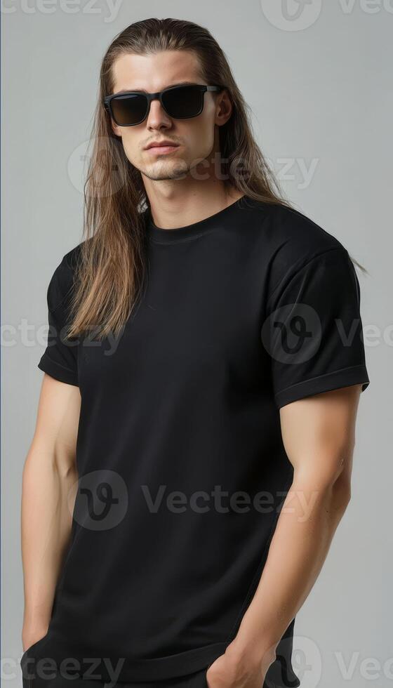 Model with long hair poses confidently, displaying a plain t-shirt effortlessly photo