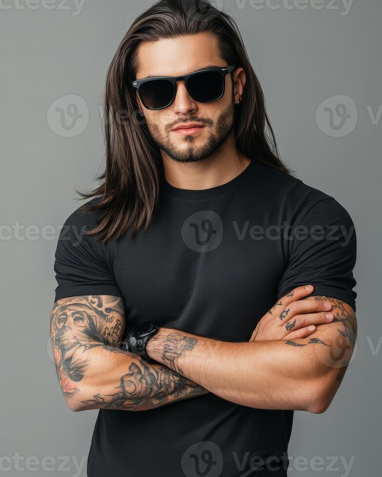 Model displays a sleek black t-shirt with confidence and attitude photo