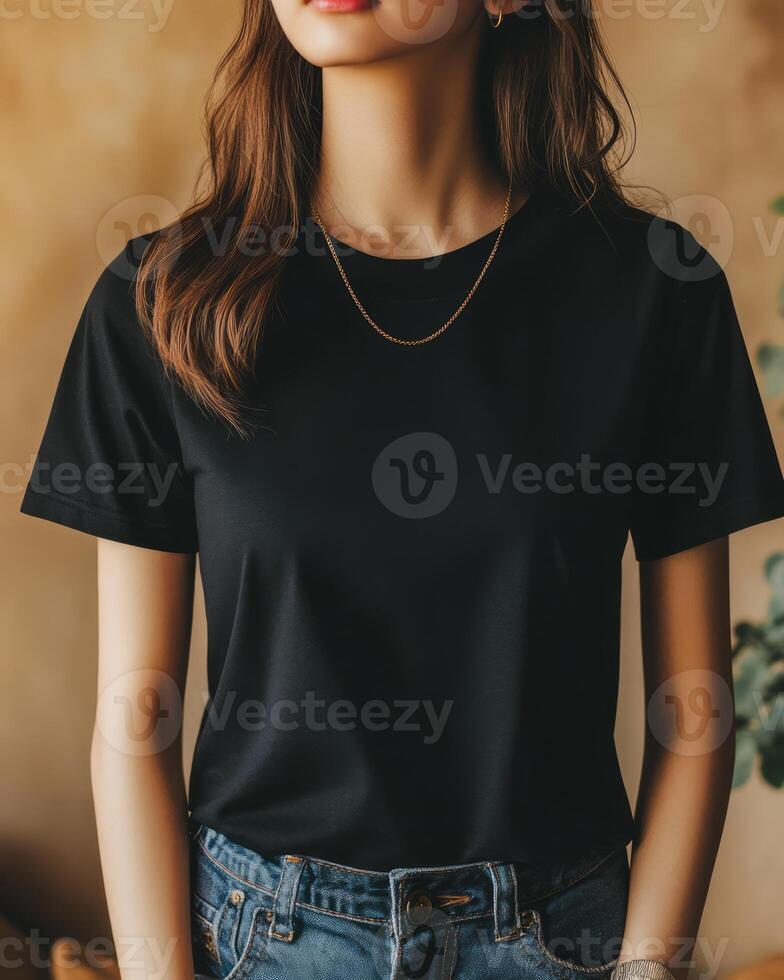 A female model presents a sleek black t-shirt with a relaxed look photo