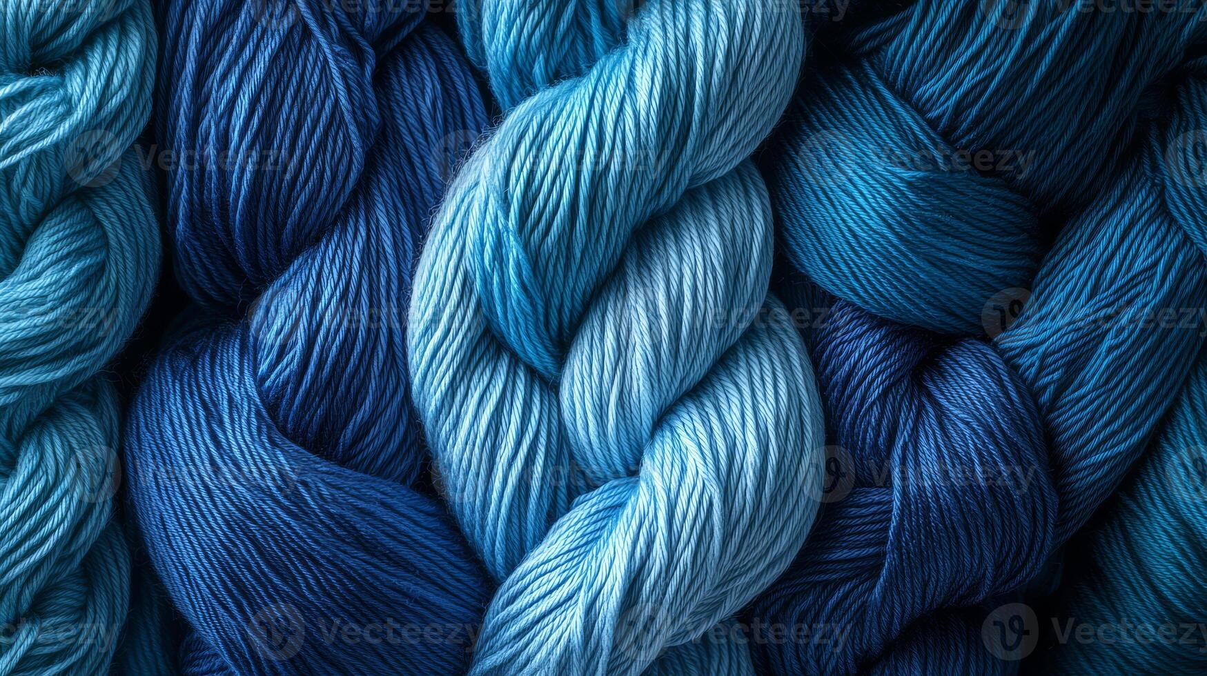 Soft blue yarns twist together, inviting creativity and artistry in crafting projects photo
