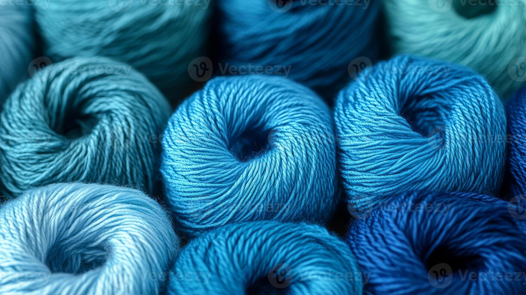 Soft blue yarn rolls create a textured display in a crafting space photo