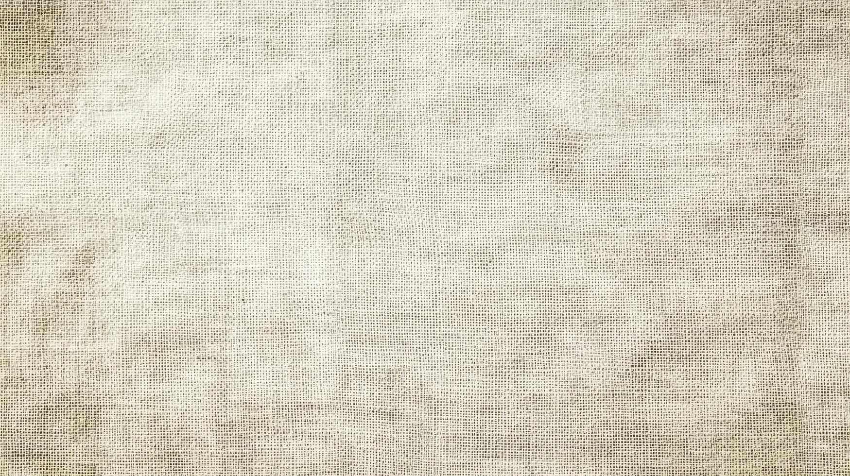 Soft, neutral fabric creates an inviting backdrop with subtle textures photo