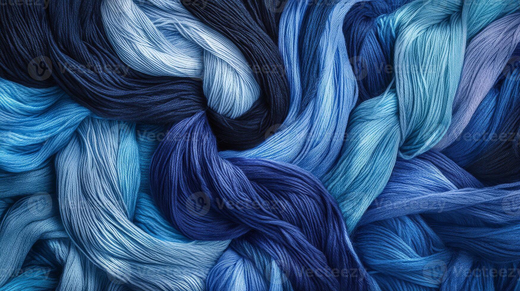 Textured strands of blue and teal yarn create a captivating visual display photo