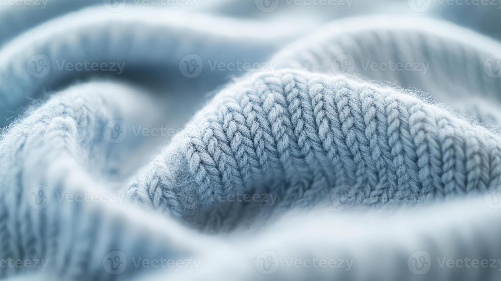 A delicate blue textile showcases intricate patterns and inviting softness photo