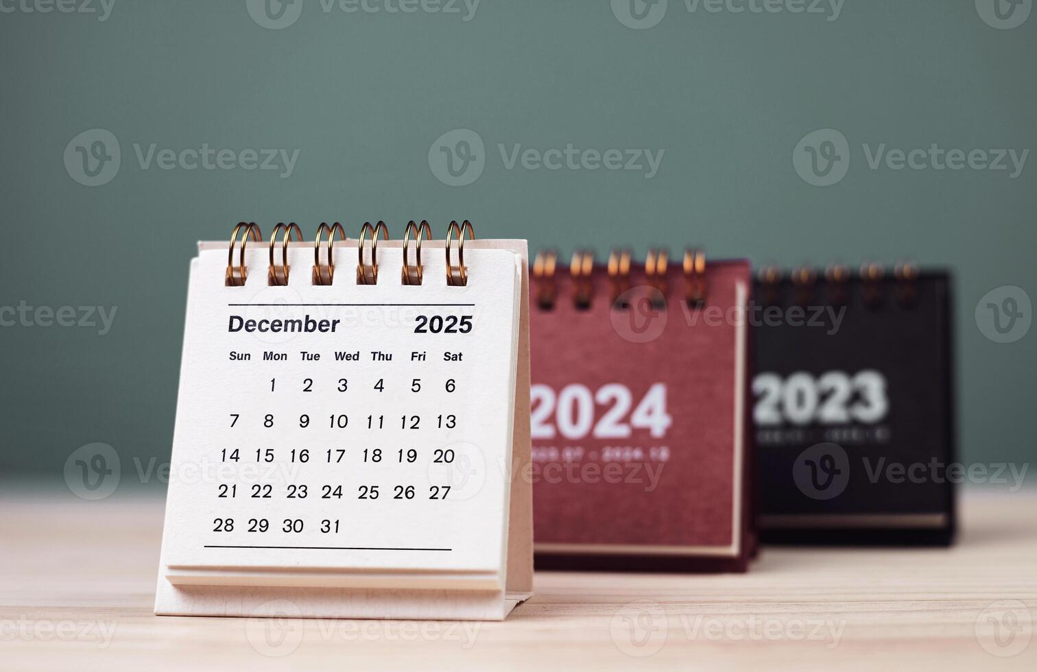 Calendar page December of the year 2025 white color on green background. with copy space and business design. concept of planning and setting new strategic goals. photo