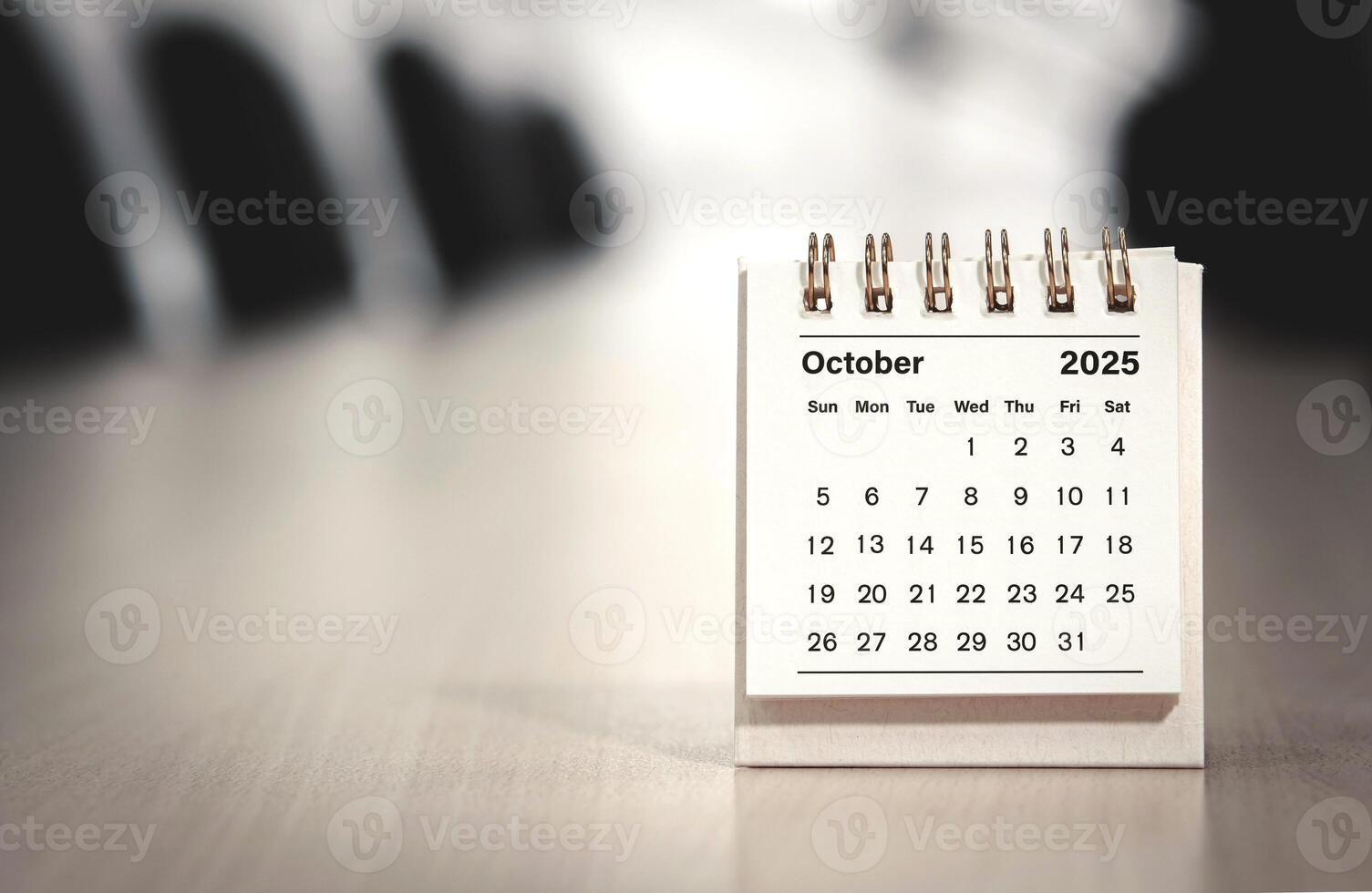 Calendar page October of the year 2025 white color in meeting room in office. with copy space and business design. concept of planning and setting new strategic goals. photo
