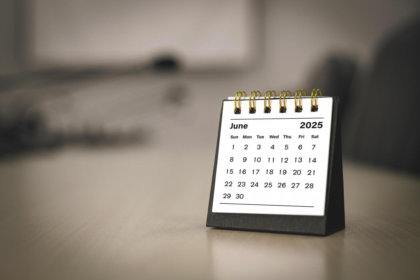 Calendar page June of the year 2025 white color in meeting room in office. with copy space and business design. concept of planning and setting new strategic goals. photo