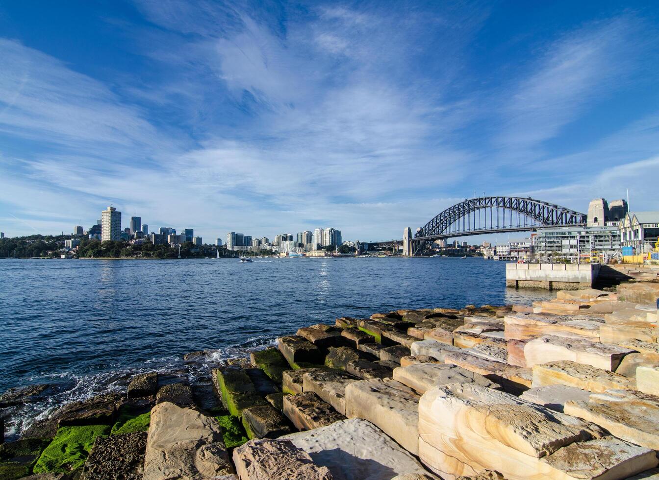Beautiful view from the west of Harbour bridge showing cityscape of North Sydney with blue sky in the background. photo