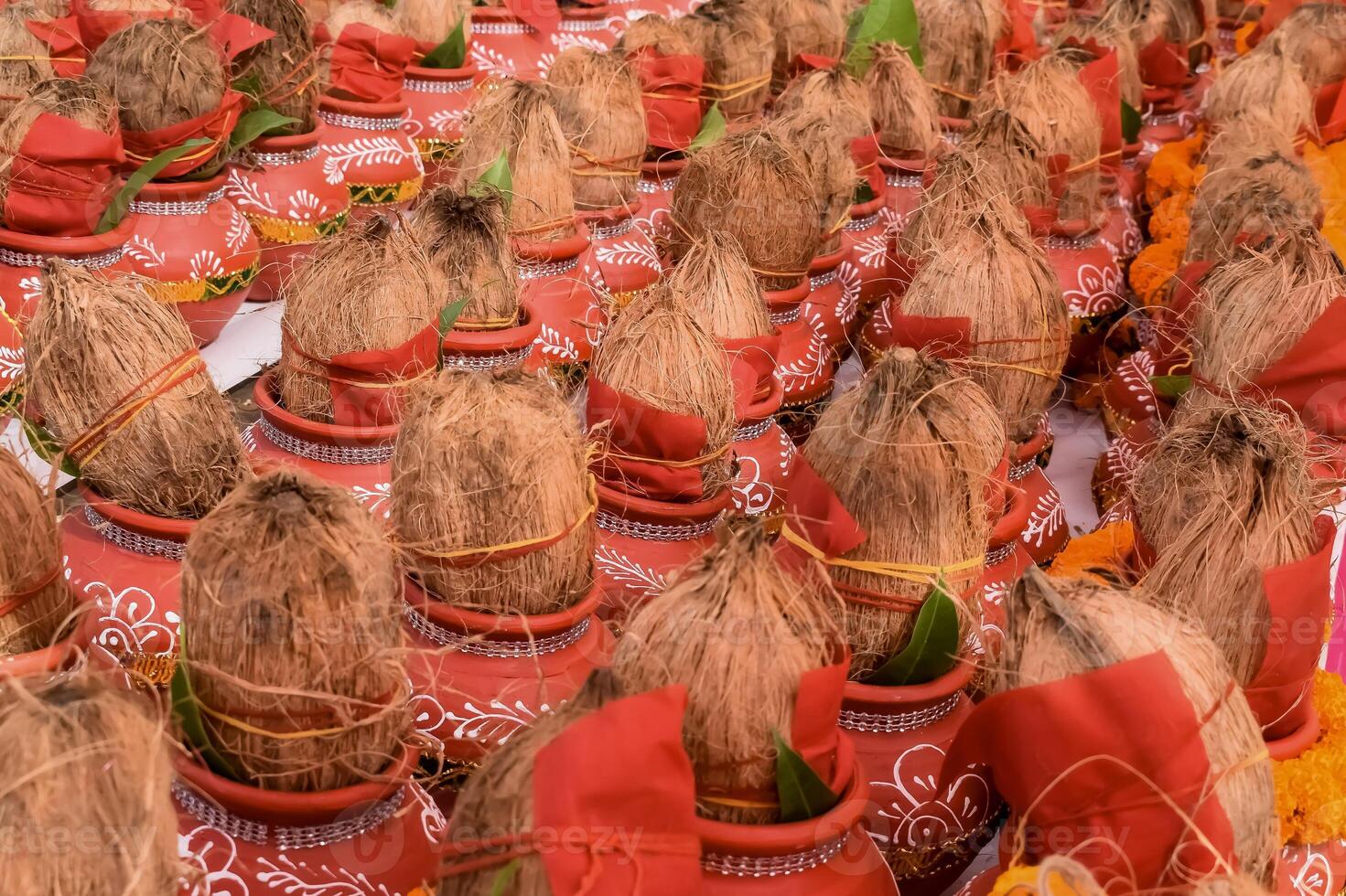 Kalash with coconut and mango leaf with floral decoration earthen pots containing sacred water. Kalash for hindu puja during Jagannath Temple Mangal Kalash Yatra, front view, closeup photo