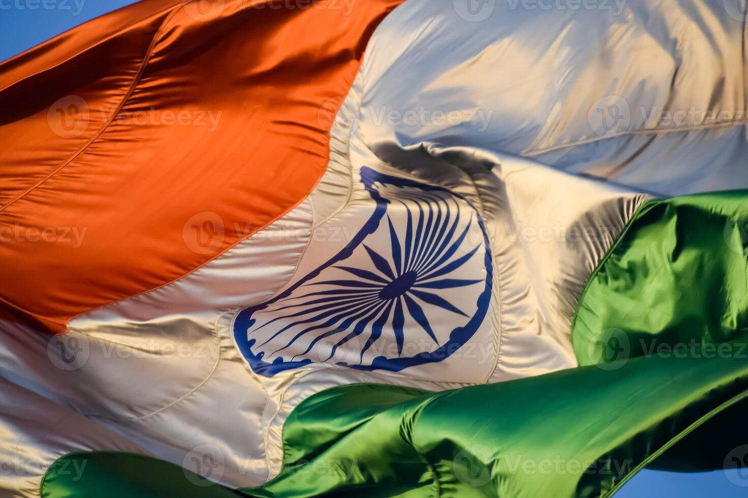 India flag flying high at Connaught Place with pride in blue sky, India flag fluttering, Indian Flag on Independence Day and Republic Day of India, tilt up shot, Waving Indian flag, Har Ghar Tiranga photo
