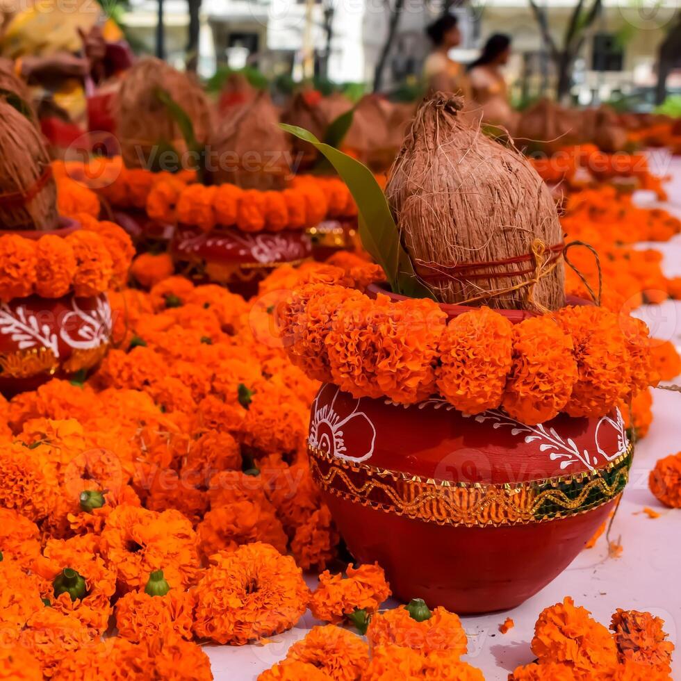 Kalash with coconut and mango leaf with floral decoration earthen pots containing sacred water. Kalash for hindu puja during Jagannath Temple Mangal Kalash Yatra, front view, closeup photo