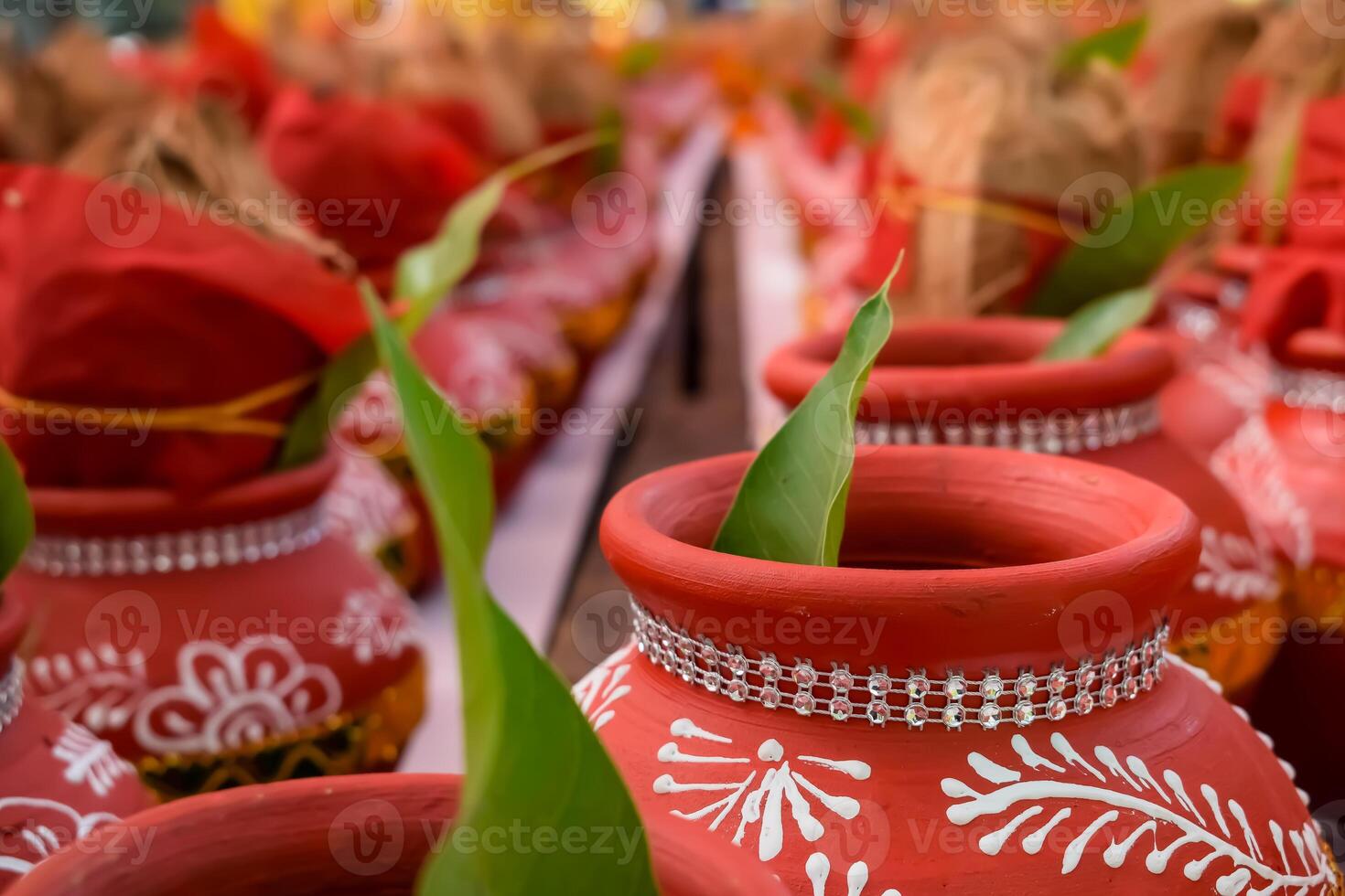 Kalash with coconut and mango leaf with floral decoration earthen pots containing sacred water. Kalash for hindu puja during Jagannath Temple Mangal Kalash Yatra, front view, closeup photo